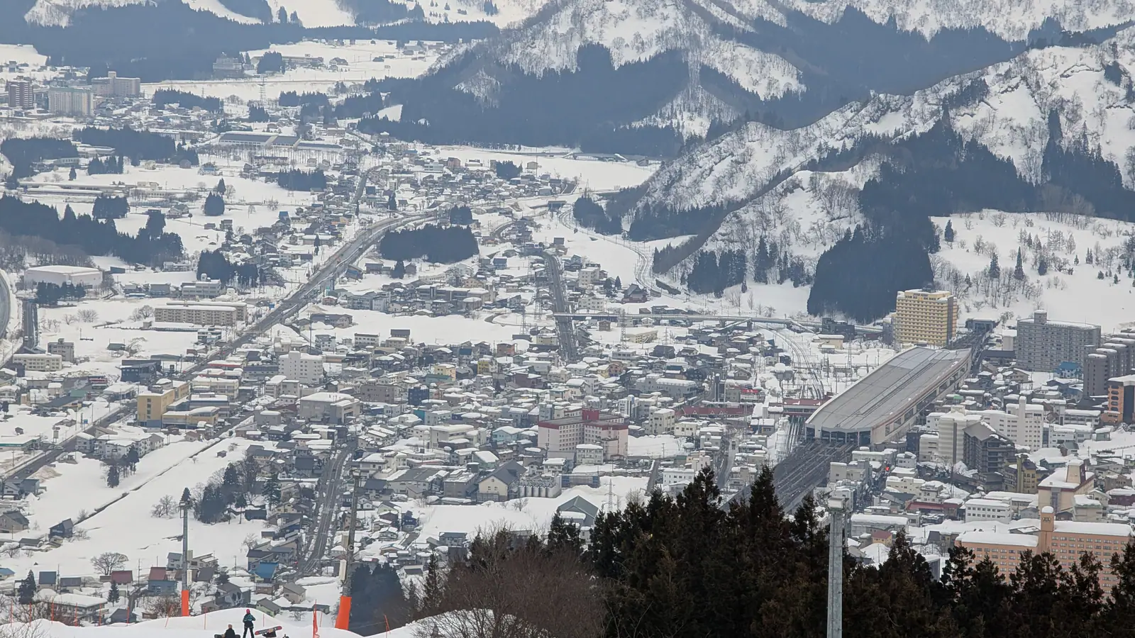 Snow-covered mountains and the valley seen from the Gala Yuzawa ski resort, Niigata