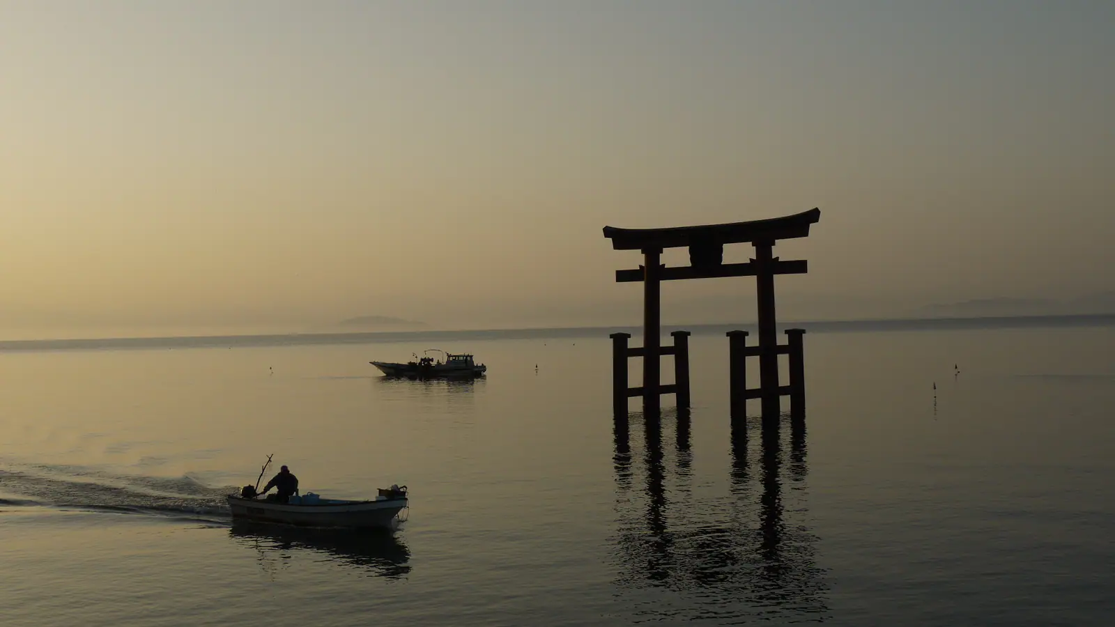 The torii gate of Shirahige Shrine standing in Lake Biwa, Shiga