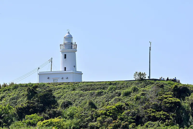Sunosaki Lighthouse above green coastal hills in Tateyama, southern Chiba