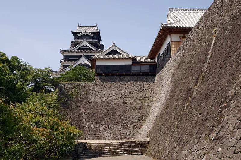 Kumamoto Castle with its dark keep and stone walls in Kumamoto Prefecture