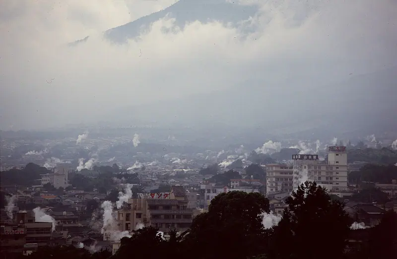Steam rising from hot spring vents across the town of Beppu in Oita Prefecture