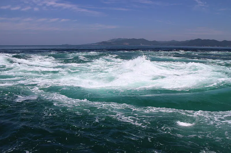 The swirling Naruto whirlpools in the strait off Tokushima Prefecture