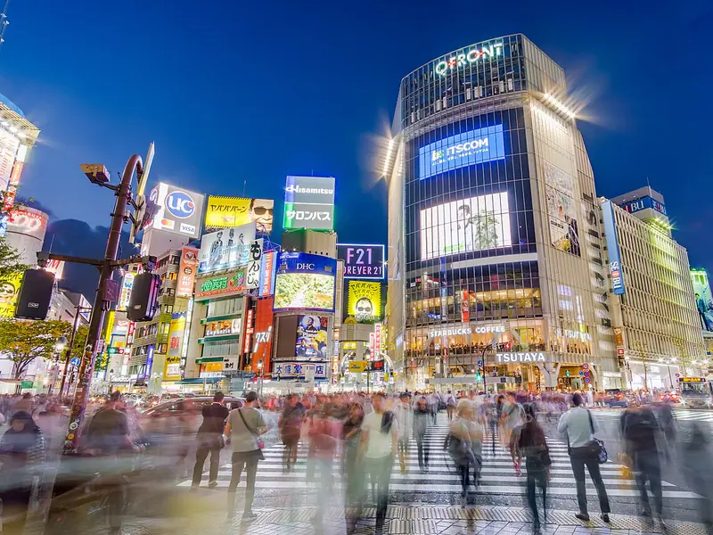 Shibuya scramble crossing lit up at night