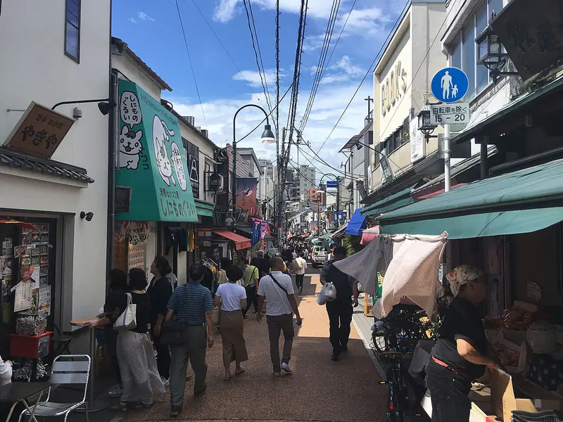 Shoppers walking through the Yanaka Ginza shopping street in Tokyo
