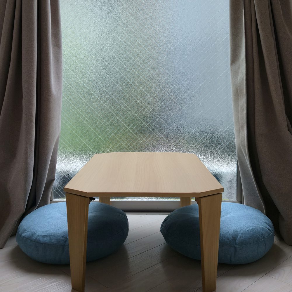 Window table and floor cushions inside JT Terrace House Yazaike #101